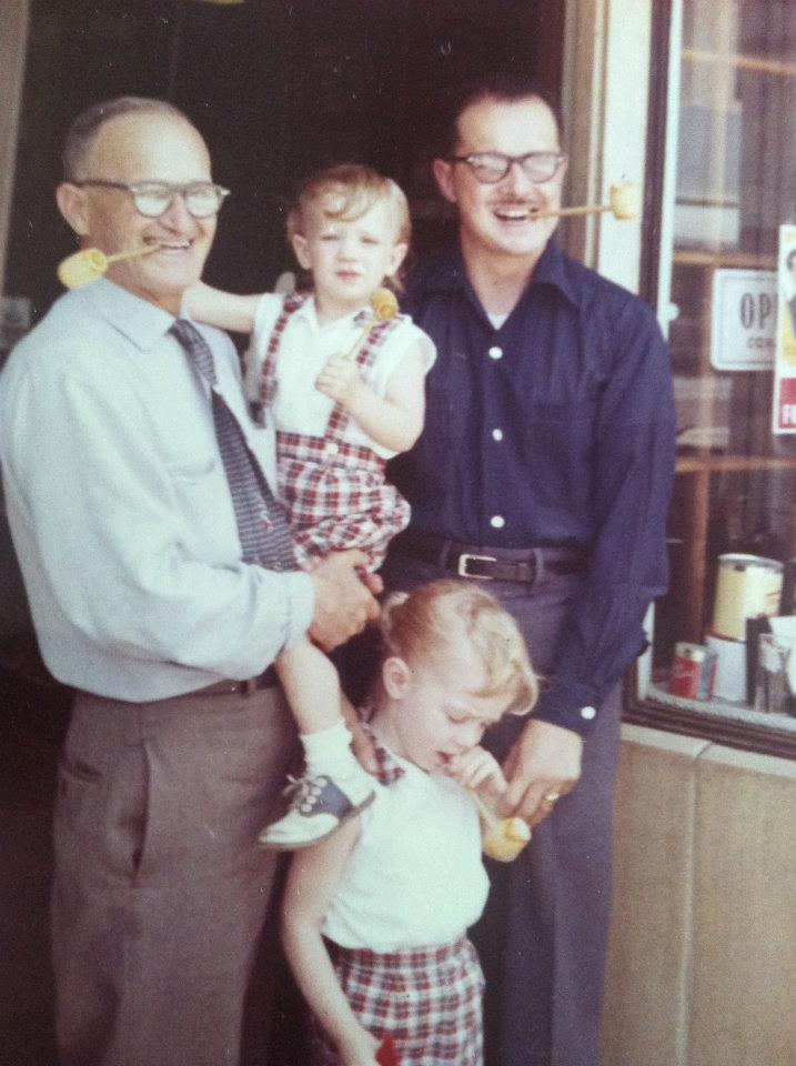 Grandpa Bouett with Rae, Adelle and Vikki outside the family's tobacco shop in downtown Los Angeles, around 1960